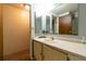 Modest bathroom featuring a neutral countertop, mirror, and basic fixtures at 1486 Harbins Rd, Norcross, GA 30093