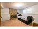 Bedroom featuring a bed and stone fireplace at 1486 Harbins Rd, Norcross, GA 30093