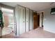 Bedroom featuring a large closet with multiple white sliding doors at 1486 Harbins Rd, Norcross, GA 30093