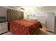 Cozy bedroom featuring a large upholstered headboard and neutral decor at 1486 Harbins Rd, Norcross, GA 30093