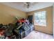 Bedroom with a ceiling fan, and natural light from the window at 1486 Harbins Rd, Norcross, GA 30093