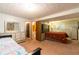 Spacious basement bedroom featuring stone fireplace and two twin beds at 1486 Harbins Rd, Norcross, GA 30093