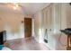 Simple bedroom featuring a bed, closet doors and a door at 1486 Harbins Rd, Norcross, GA 30093