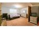 Bedroom with full bed and dresser plus door to the rest of the property at 1486 Harbins Rd, Norcross, GA 30093