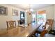 Dining room with a chandelier, wood table, and sliding door leading to an outdoor space at 1486 Harbins Rd, Norcross, GA 30093