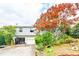 Charming home with a driveway leading to an attached garage and mature landscaping at 1486 Harbins Rd, Norcross, GA 30093