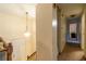 Hallway with chandelier and stairs leading up to the bedrooms and main living areas at 1486 Harbins Rd, Norcross, GA 30093