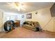 Bright living room with a cozy couch, ceiling fan, view into the dining room, creating a welcoming space at 1486 Harbins Rd, Norcross, GA 30093