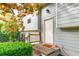 Side entry showcasing the exterior door, siding, and surrounding greenery of the house at 1486 Harbins Rd, Norcross, GA 30093