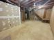 Basement area with unfinished walls, open ceiling, and staircase access at 5791 Warren Farm Sw Rd, Powder Springs, GA 30127