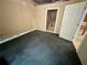 Basement area with sealed concrete floors, and access to a storage area at 5791 Warren Farm Sw Rd, Powder Springs, GA 30127