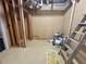 Basement area with exposed beams, wooden studs, and room for storage at 5791 Warren Farm Sw Rd, Powder Springs, GA 30127