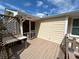 Outdoor deck space with wood flooring, railings, and a view of the backyard at 5791 Warren Farm Sw Rd, Powder Springs, GA 30127