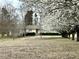 Charming home featuring a sprawling front yard and mature trees, creating a serene setting at 5791 Warren Farm Sw Rd, Powder Springs, GA 30127