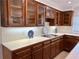 Kitchen with custom cabinetry, tile countertops and backsplash, and updated fixtures at 5791 Warren Farm Sw Rd, Powder Springs, GA 30127
