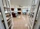 Spacious eat-in kitchen featuring an island, modern appliances, tile floors, and bright light at 5791 Warren Farm Sw Rd, Powder Springs, GA 30127