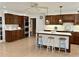 Well-designed kitchen with a tile island, glass front cabinets, and updated appliances at 5791 Warren Farm Sw Rd, Powder Springs, GA 30127