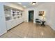 Sitting area featuring tile floors, built-in storage, and neutral paint at 5791 Warren Farm Sw Rd, Powder Springs, GA 30127
