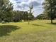 Large, well-maintained yard with mature trees providing shade and a picturesque setting at 5791 Warren Farm Sw Rd, Powder Springs, GA 30127