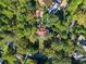 Aerial view of the home's lush grounds, including a pool and mature trees at 8 W Andrews Nw Dr, Atlanta, GA 30305