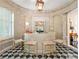 Stylish home bar with black and white tile floor, modern lighting, and bar stools at 8 W Andrews Nw Dr, Atlanta, GA 30305