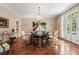 Formal dining room featuring hardwood floors, a chandelier, and double doors at 8 W Andrews Nw Dr, Atlanta, GA 30305