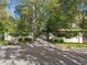Elegant gated entrance with manicured landscaping leading to the estate at 8 W Andrews Nw Dr, Atlanta, GA 30305