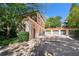 Charming home exterior featuring a multi-car garage and ample parking space at 8 W Andrews Nw Dr, Atlanta, GA 30305