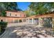 Elegant home with a multi-car garage, complemented by beautiful landscaping and architecture at 8 W Andrews Nw Dr, Atlanta, GA 30305