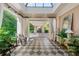 Bright foyer with black and white tile floors, glass ceiling, and views of the backyard at 8 W Andrews Nw Dr, Atlanta, GA 30305