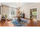 Grand foyer with hardwood floors, chandelier, and French doors to the outside at 8 W Andrews Nw Dr, Atlanta, GA 30305