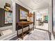 Hallway with dark walls and tile accents leading to an open kitchen at 8 W Andrews Nw Dr, Atlanta, GA 30305