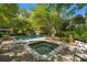 Relax in the backyard hot tub and enjoy the lush landscaping and outdoor seating at 8 W Andrews Nw Dr, Atlanta, GA 30305