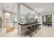 Open concept kitchen showcasing an island, black countertops, tiled floor, pendant lighting, and eat-in breakfast area at 8 W Andrews Nw Dr, Atlanta, GA 30305