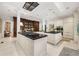 Well-appointed kitchen featuring black countertops, custom cabinetry, and stainless steel appliances in a bright space at 8 W Andrews Nw Dr, Atlanta, GA 30305
