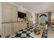 Bright living room featuring checkerboard floors, built-in storage, and elegant furnishings at 8 W Andrews Nw Dr, Atlanta, GA 30305