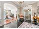 Open concept living room with polished hardwood floors, ornate archways, and elegant furnishings at 8 W Andrews Nw Dr, Atlanta, GA 30305