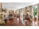 Sunlit living room with parquet floors, decorative fireplace, and French doors to the exterior at 8 W Andrews Nw Dr, Atlanta, GA 30305