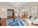 Spacious formal living room with hardwood floors, chandelier, and classic furnishings at 8 W Andrews Nw Dr, Atlanta, GA 30305