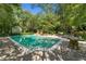 Enjoy the pool and lounge area in a private, lush backyard oasis at 8 W Andrews Nw Dr, Atlanta, GA 30305