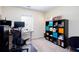 Bedroom with a large workspace for multiple computers and a printer setup at 1037 Dunedin Trl, Woodstock, GA 30188