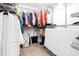 Walk-in closet featuring built-in shelving and ample hanging space for organized clothing and accessories at 1037 Dunedin Trl, Woodstock, GA 30188