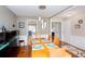 Dining room showcasing modern lighting and an open floor plan with hardwood floors at 1037 Dunedin Trl, Woodstock, GA 30188