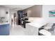 Modern kitchen features stainless steel appliances, custom cabinetry, and a breakfast bar with stylish seating at 1037 Dunedin Trl, Woodstock, GA 30188