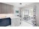Modern kitchen with a breakfast bar and sliding glass doors leading to a sunroom at 1037 Dunedin Trl, Woodstock, GA 30188