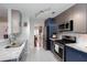 Stylish kitchen featuring stainless steel appliances, granite countertops, and subway tile backsplash at 1037 Dunedin Trl, Woodstock, GA 30188