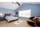 Spacious main bedroom with vaulted ceilings, a ceiling fan, and a sitting area for relaxation at 1037 Dunedin Trl, Woodstock, GA 30188
