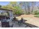 A view of the patio with chairs and a sliding glass door into the house at 1037 Dunedin Trl, Woodstock, GA 30188