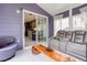 Comfortable sunroom showcases a large sliding glass door leading to the kitchen, and modern seating at 1037 Dunedin Trl, Woodstock, GA 30188