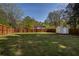 Large backyard with a wooden privacy fence and storage shed provides a peaceful outdoor space at 2189 Gordon Se Cir, Smyrna, GA 30080